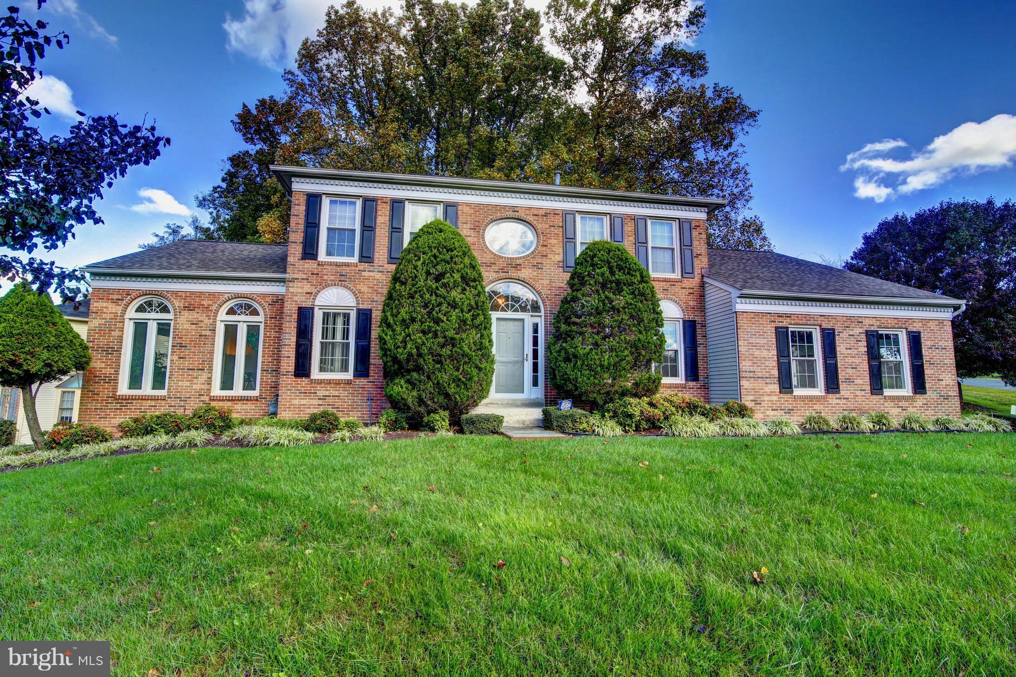 14515 Cutstone Way Silver Spring, MD 20905 - Photo 1 of 29 a view of a house with a yard and plants