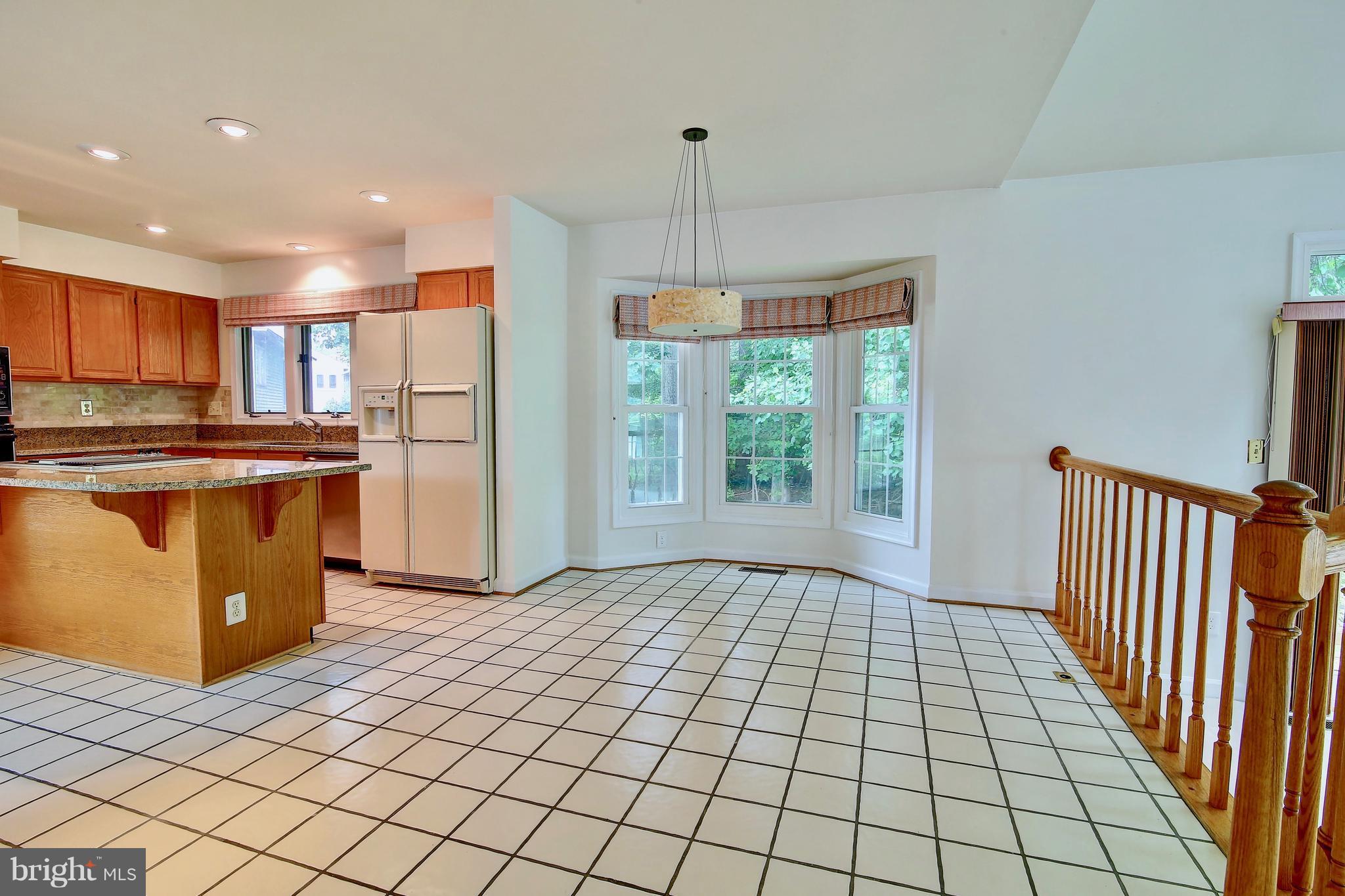 14515 Cutstone Way Silver Spring, MD 20905 - Photo 11 of 29 a kitchen with stainless steel appliances a refrigerator and a stove top oven
