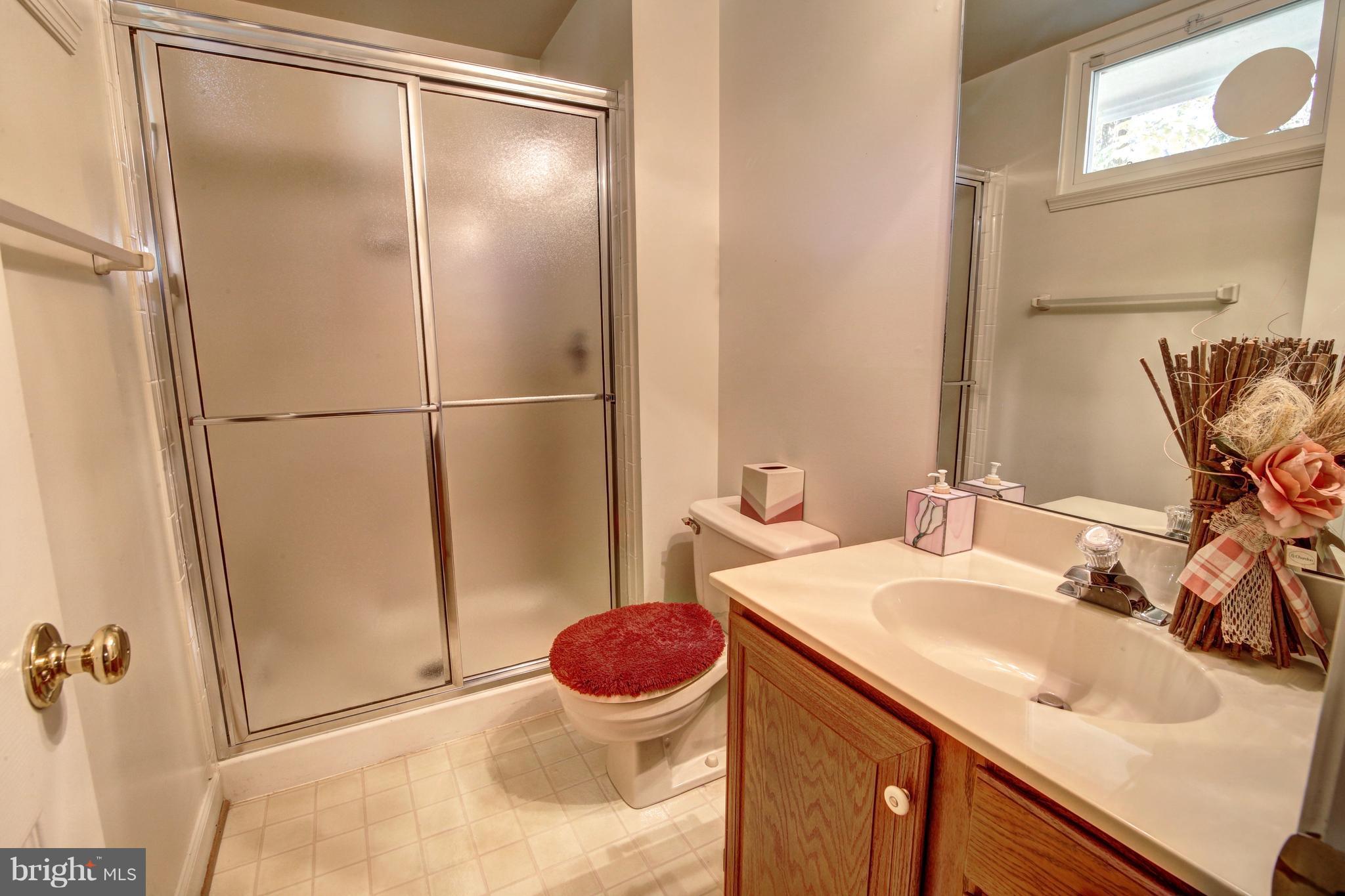 14515 Cutstone Way Silver Spring, MD 20905 - Photo 26 of 29 a bathroom with a sink toilet and shower