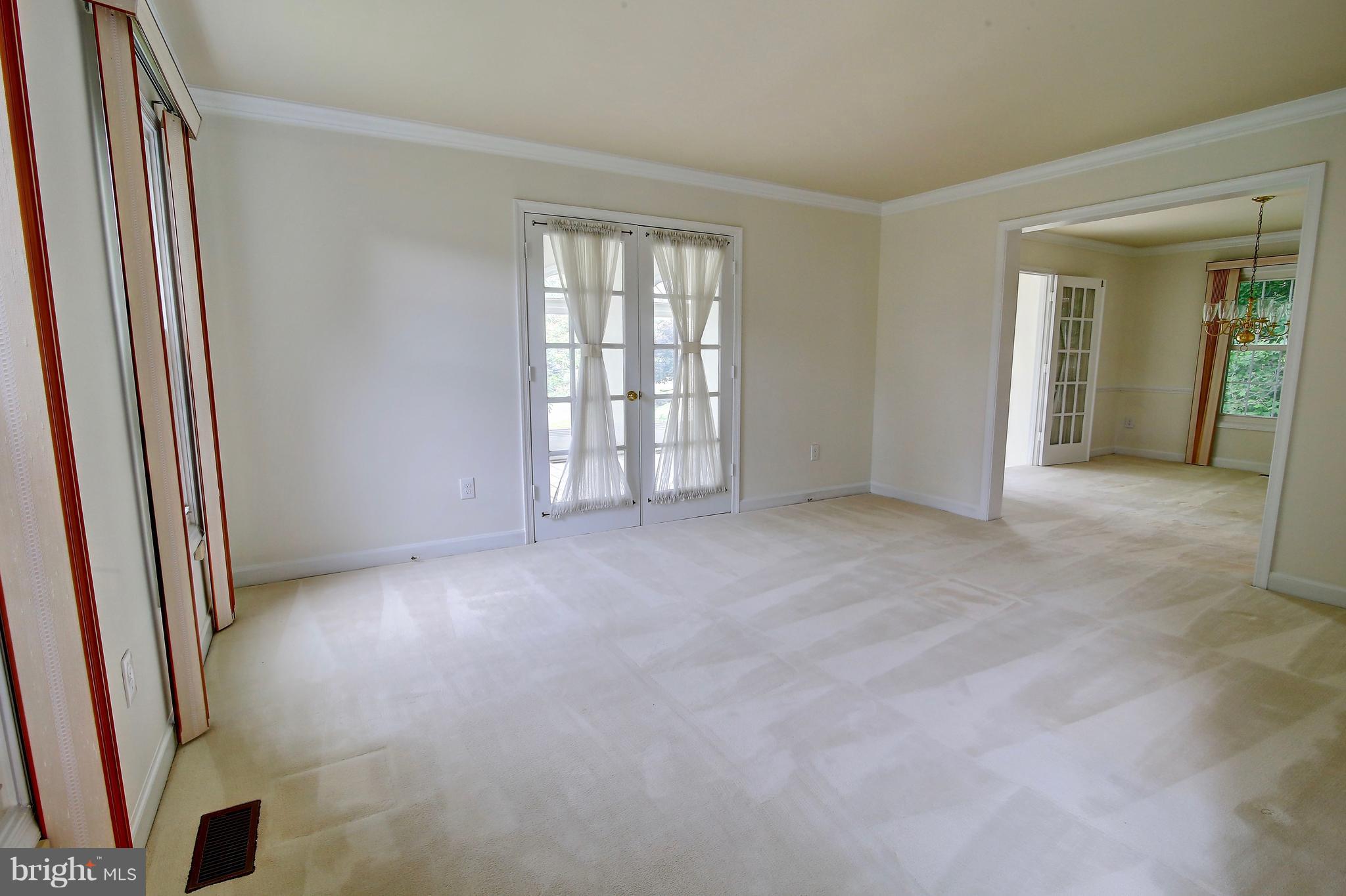 14515 Cutstone Way Silver Spring, MD 20905 - Photo 5 of 29 an empty room with windows