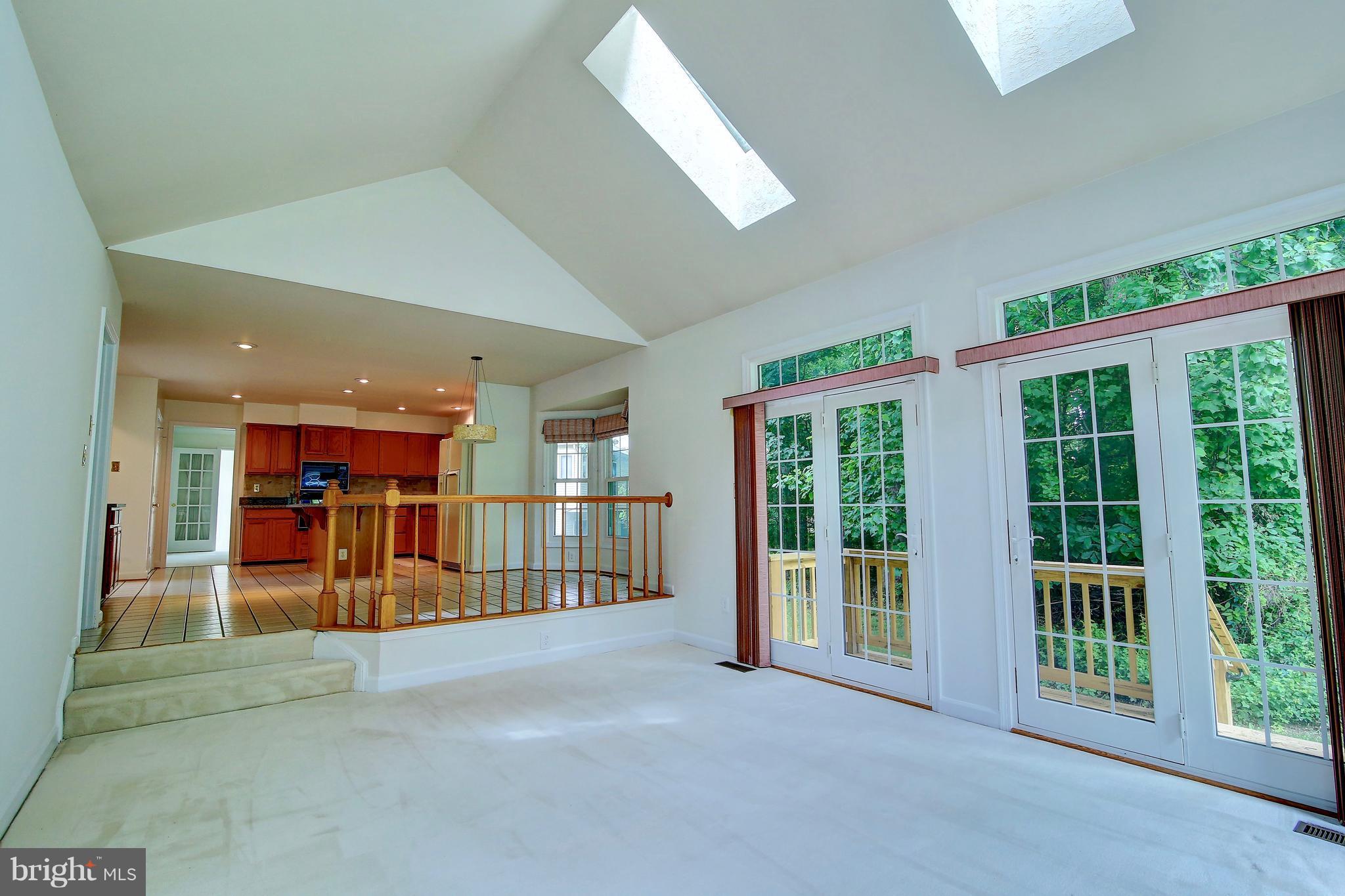 14515 Cutstone Way Silver Spring, MD 20905 - Photo 10 of 29 a view of an empty room with large windows
