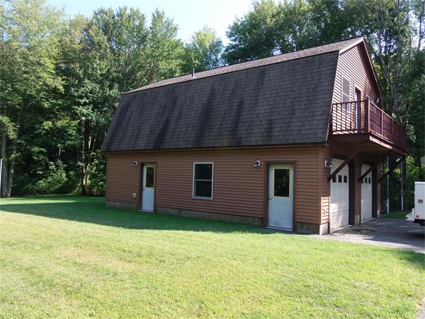 1235 Bemis Road Warren, MA 01083 - Photo 14 of 20 a front view of house with yard and trees in the background