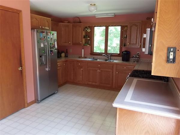 1235 Bemis Road Warren, MA 01083 - Photo 7 of 20 a kitchen with stainless steel appliances granite countertop a refrigerator a sink dishwasher stove and refrigerator