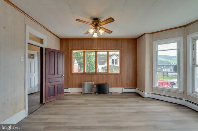 a view of an empty room with a window