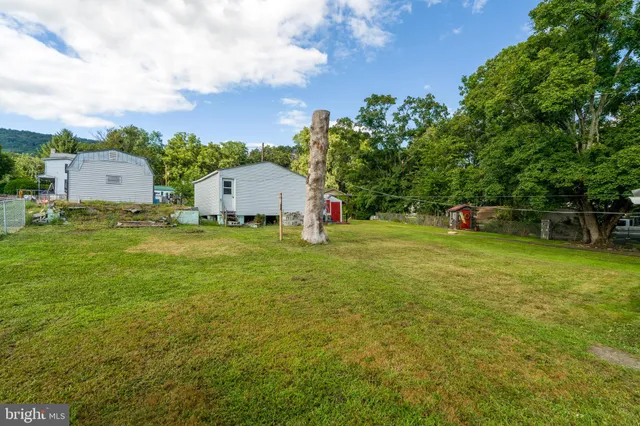 a view of a house with a big yard