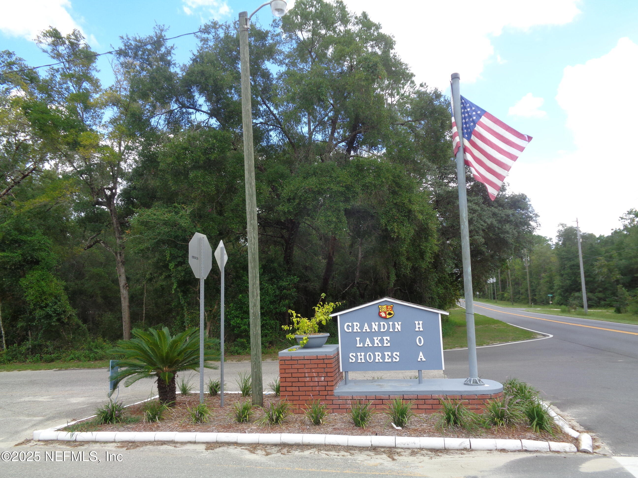 0 Lake Shore Interlachen, FL 32148 - Photo 2 of 11 a sign that is on the side of a road