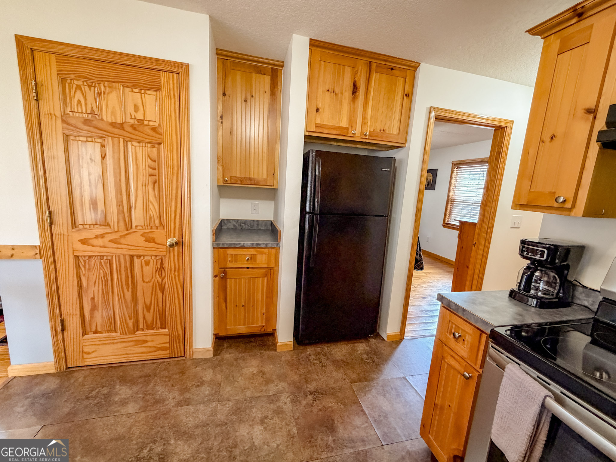 703 Zeppelin Strasse Helen, GA 30545 - Photo 11 of 28 a view of a kitchen with an entryway and wooden floor