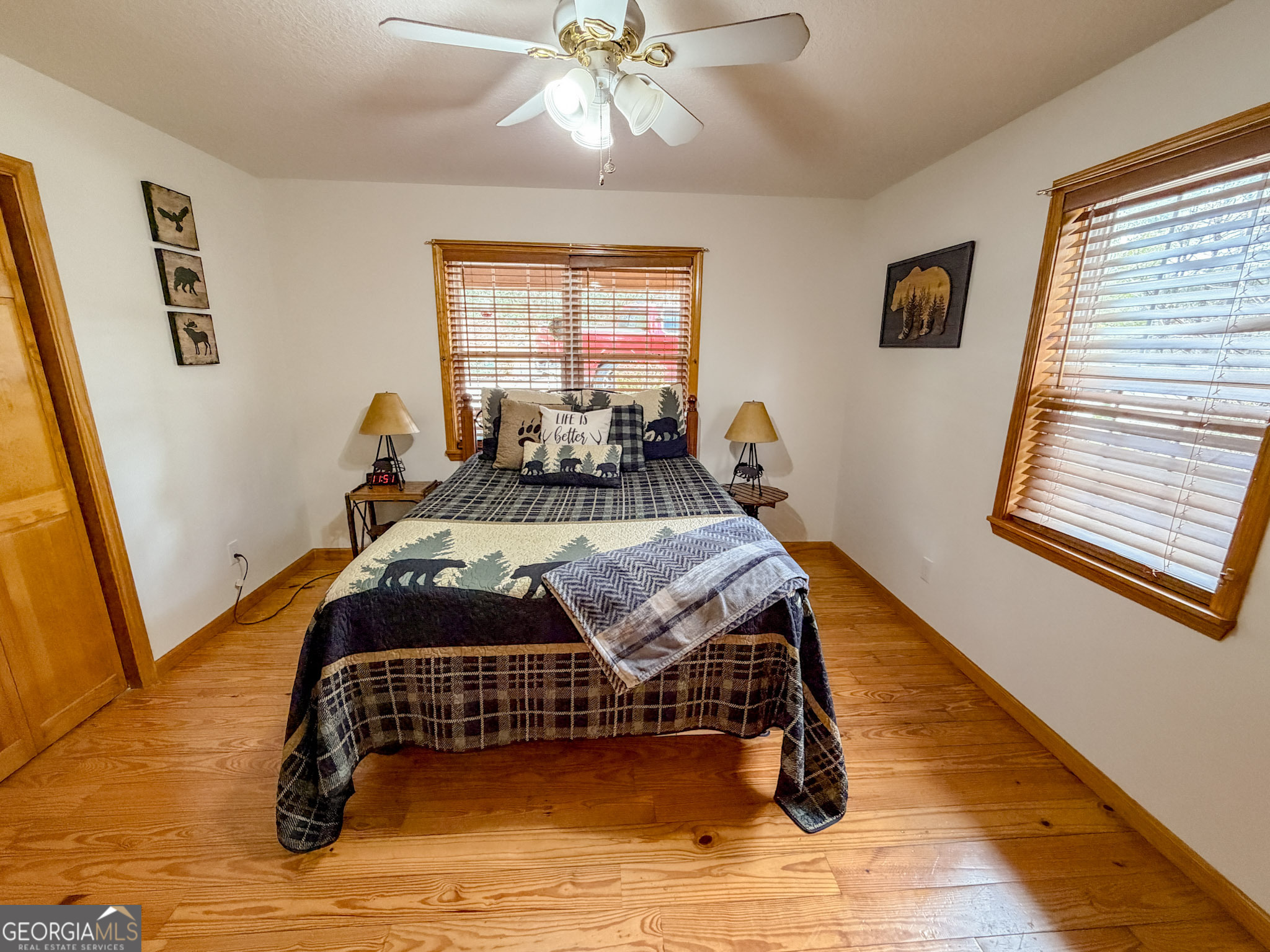 703 Zeppelin Strasse Helen, GA 30545 - Photo 12 of 28 a bedroom with a bed and wooden floor