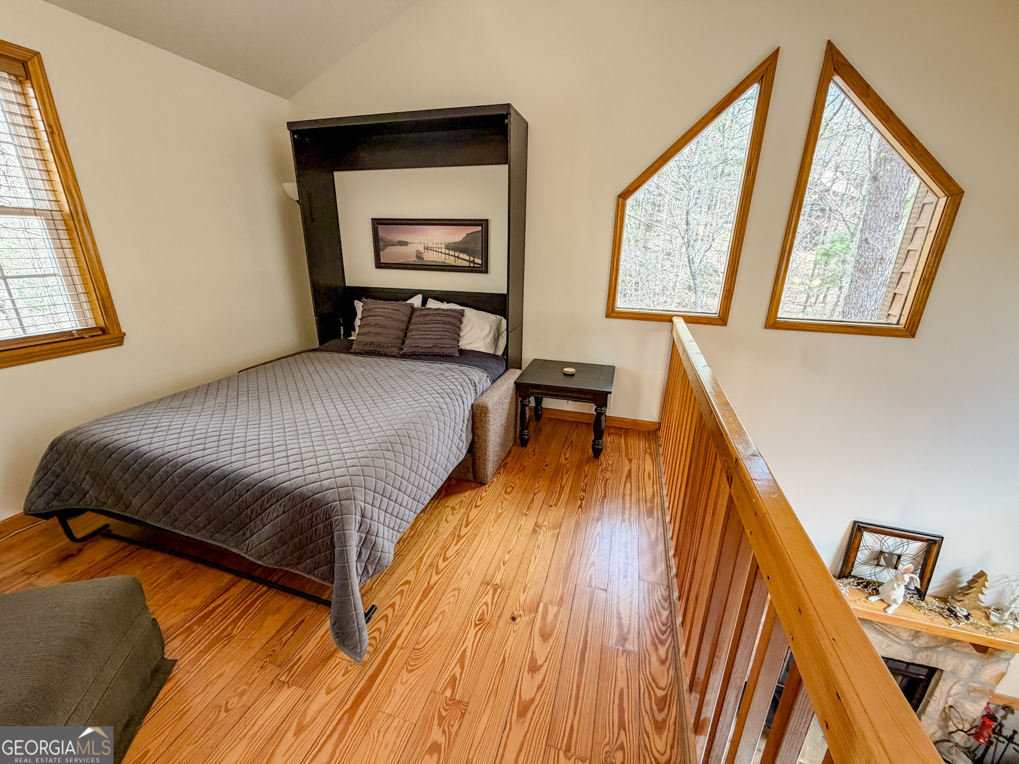 703 Zeppelin Strasse Helen, GA 30545 - Photo 20 of 28 a bedroom with a bed and a large window