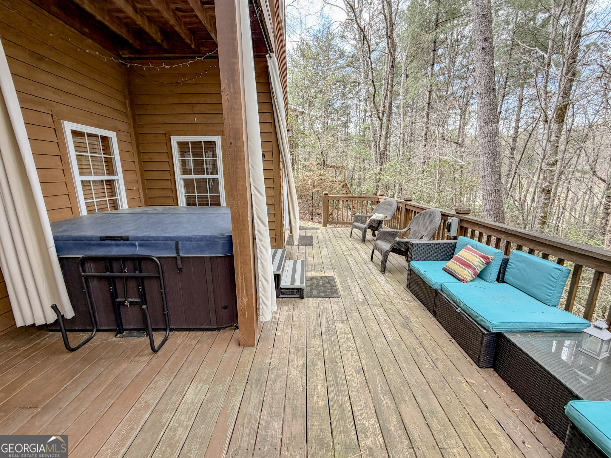 703 Zeppelin Strasse Helen, GA 30545 - Photo 25 of 28 a balcony with wooden floor and furniture