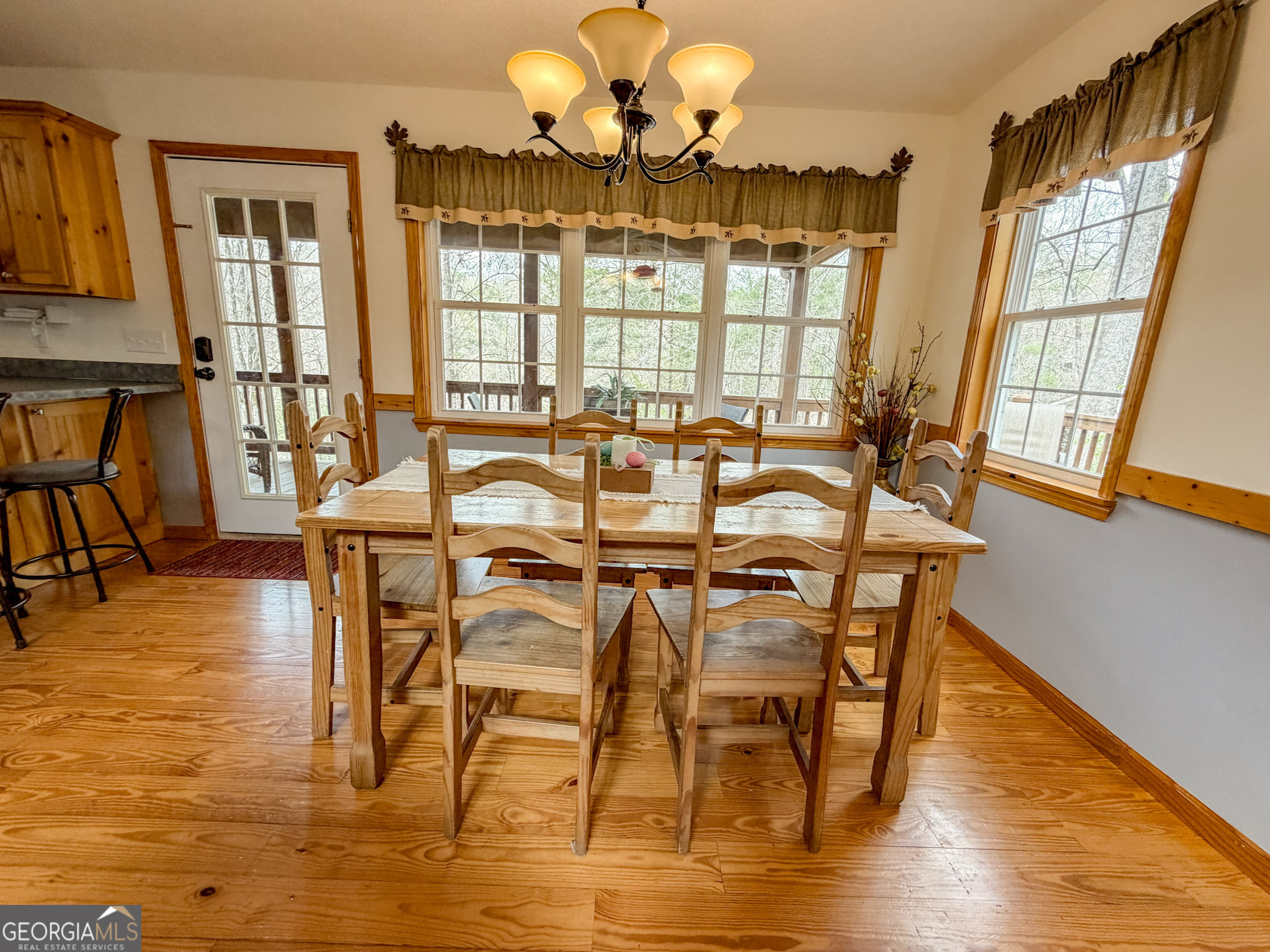 703 Zeppelin Strasse Helen, GA 30545 - Photo 9 of 28 a view of a dining room with furniture and wooden floor