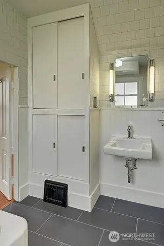 a bathroom with a bathtub and shower