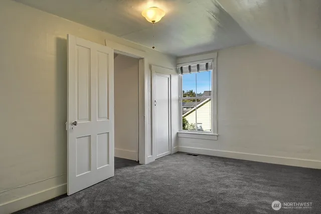 a view of a room with wooden walls