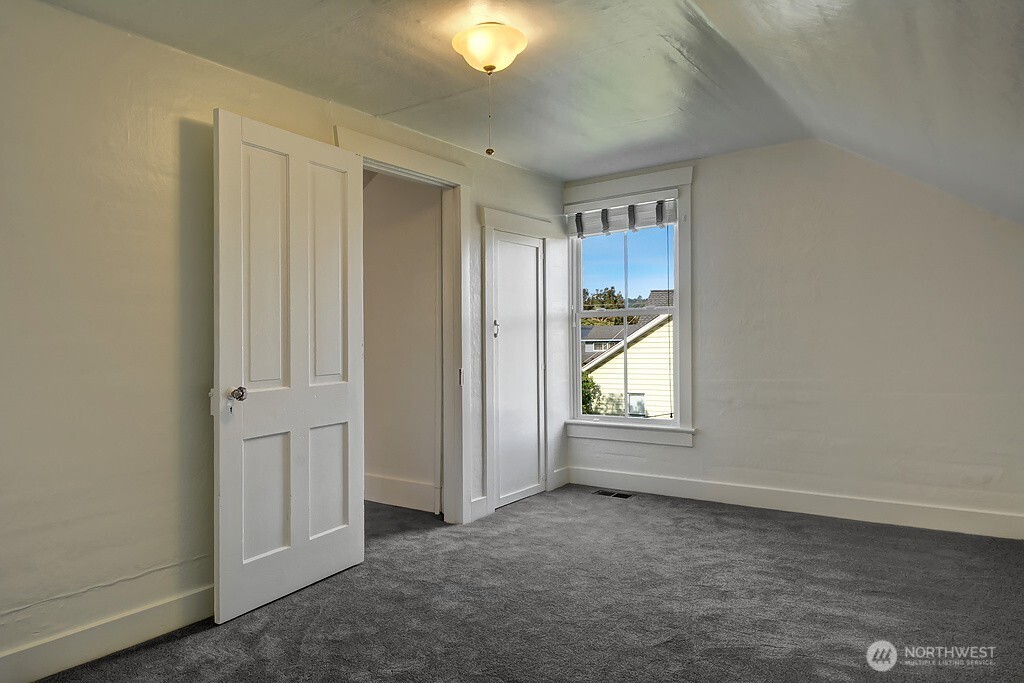 5403 Maynard Avenue South Seattle, WA 98108 - Photo 18 of 26 an empty room with windows and closet