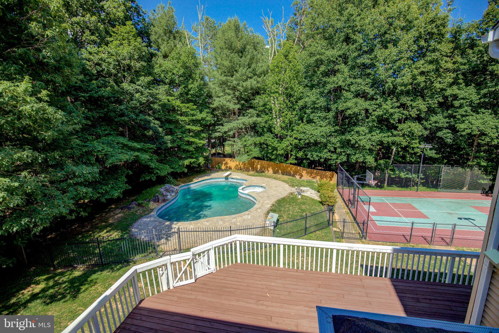 813 Blacks Hill Road Great Falls, VA 22066 - Photo 75 of 92 View from UL Deck to Pool, Hot Tub & Sports Court