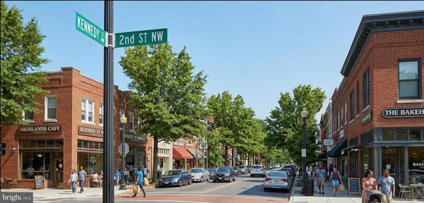 a city street lined with buildings and trees