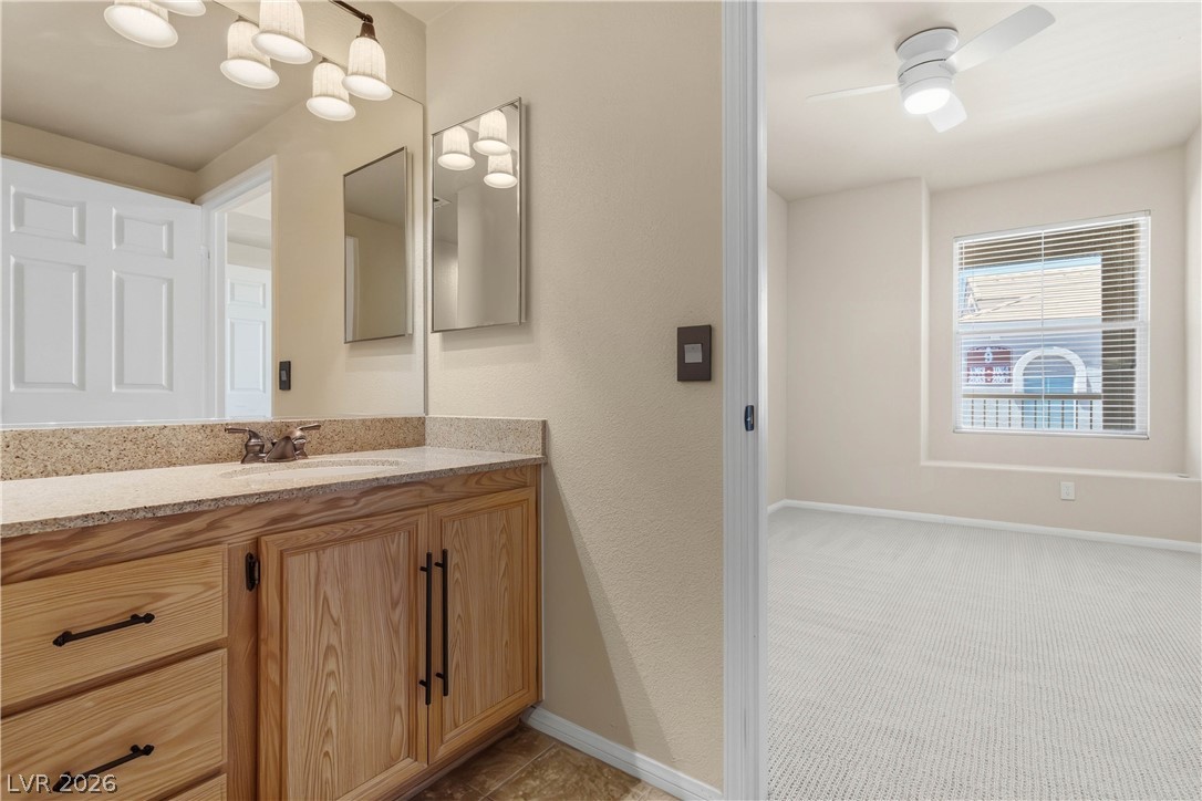 10550 West Alexander Road, Unit 2060 Las Vegas, NV 89129 - Photo 29 of 45 Functional vanity with ample counter space connects seamlessly to a well-appointed room.