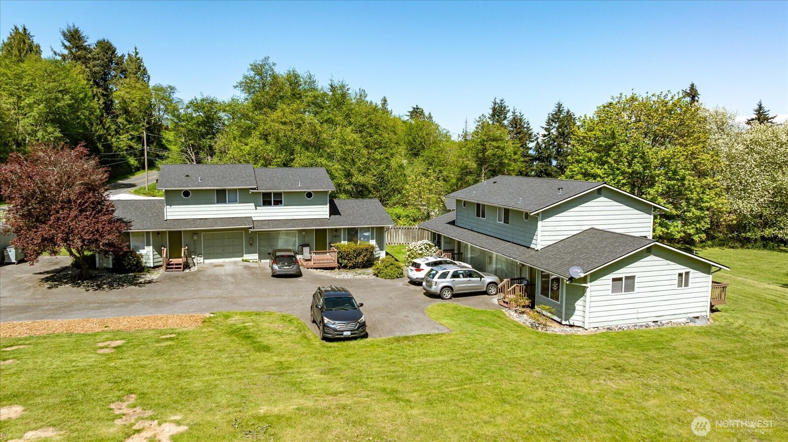 6305 Bob Galbreath Road Clinton, WA 98236 - Photo 1 of 21 an aerial view of a house with swimming pool garden and mountain view