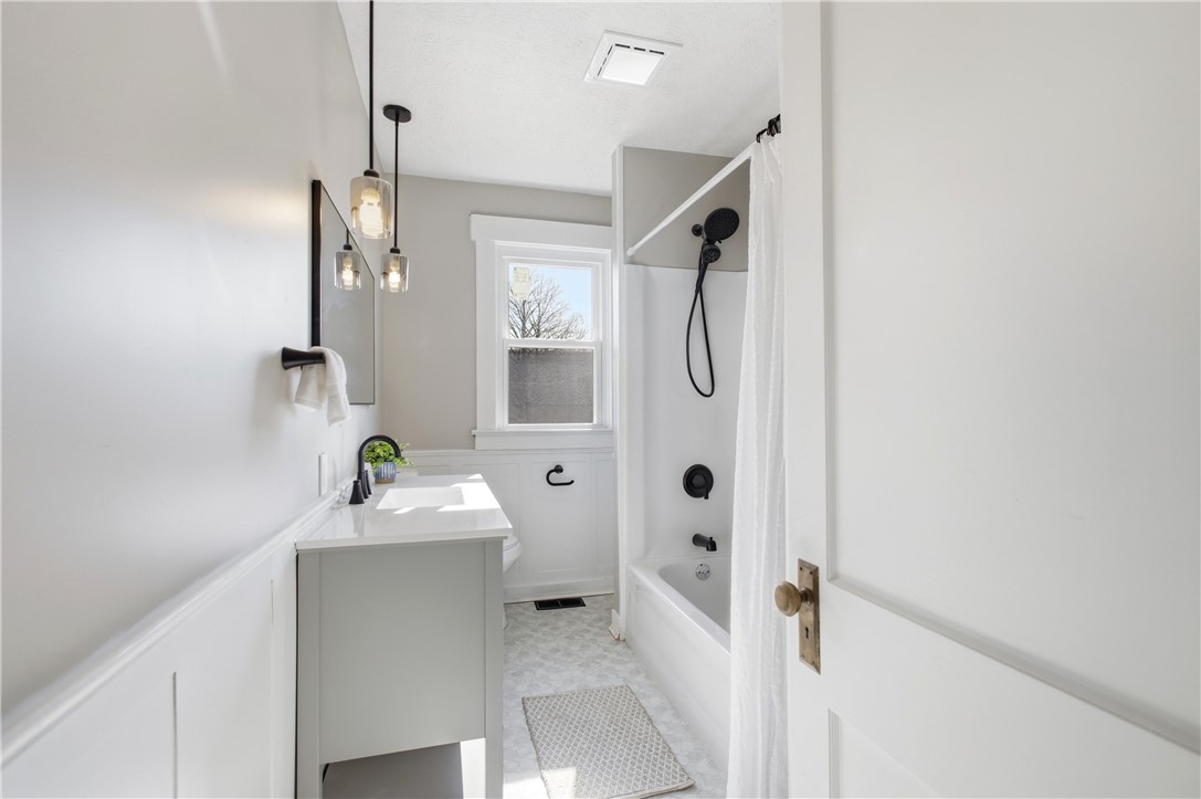 1925 Sunset Avenue Springfield, OH 45505 - Photo 24 of 45 This bathroom features a sleek vanity, modern lighting, and a refreshing shower and tub combination.