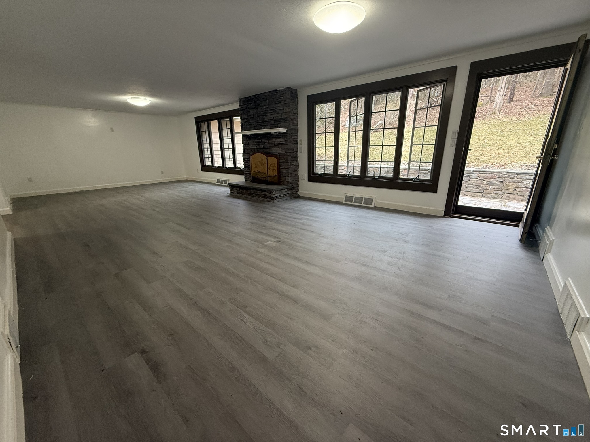 110 Town Woods Road Lyme, CT 06371 - Photo 12 of 37 wooden floor in an empty room with a window