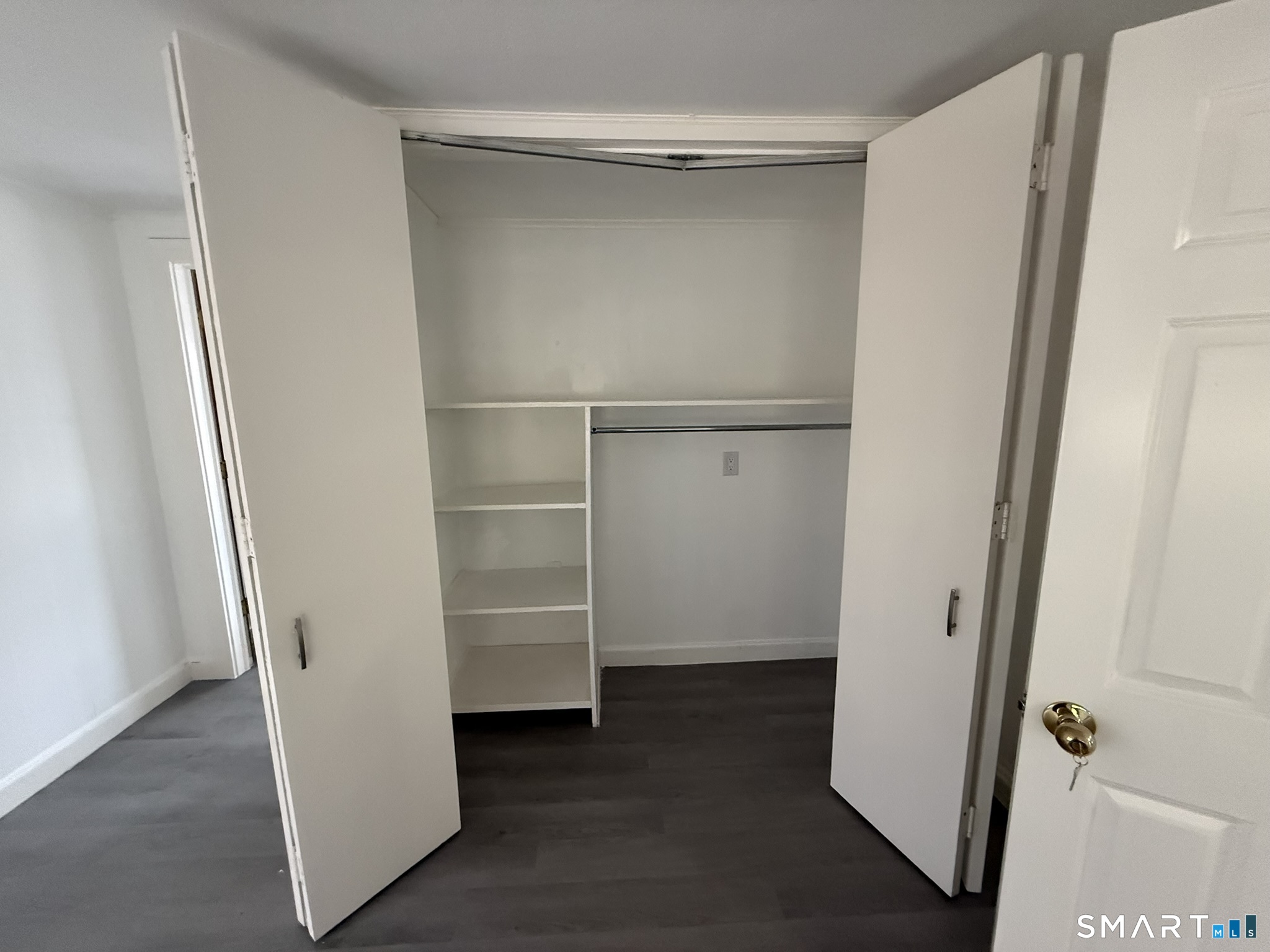 110 Town Woods Road Lyme, CT 06371 - Photo 28 of 37 a view of walk in closet with empty racks