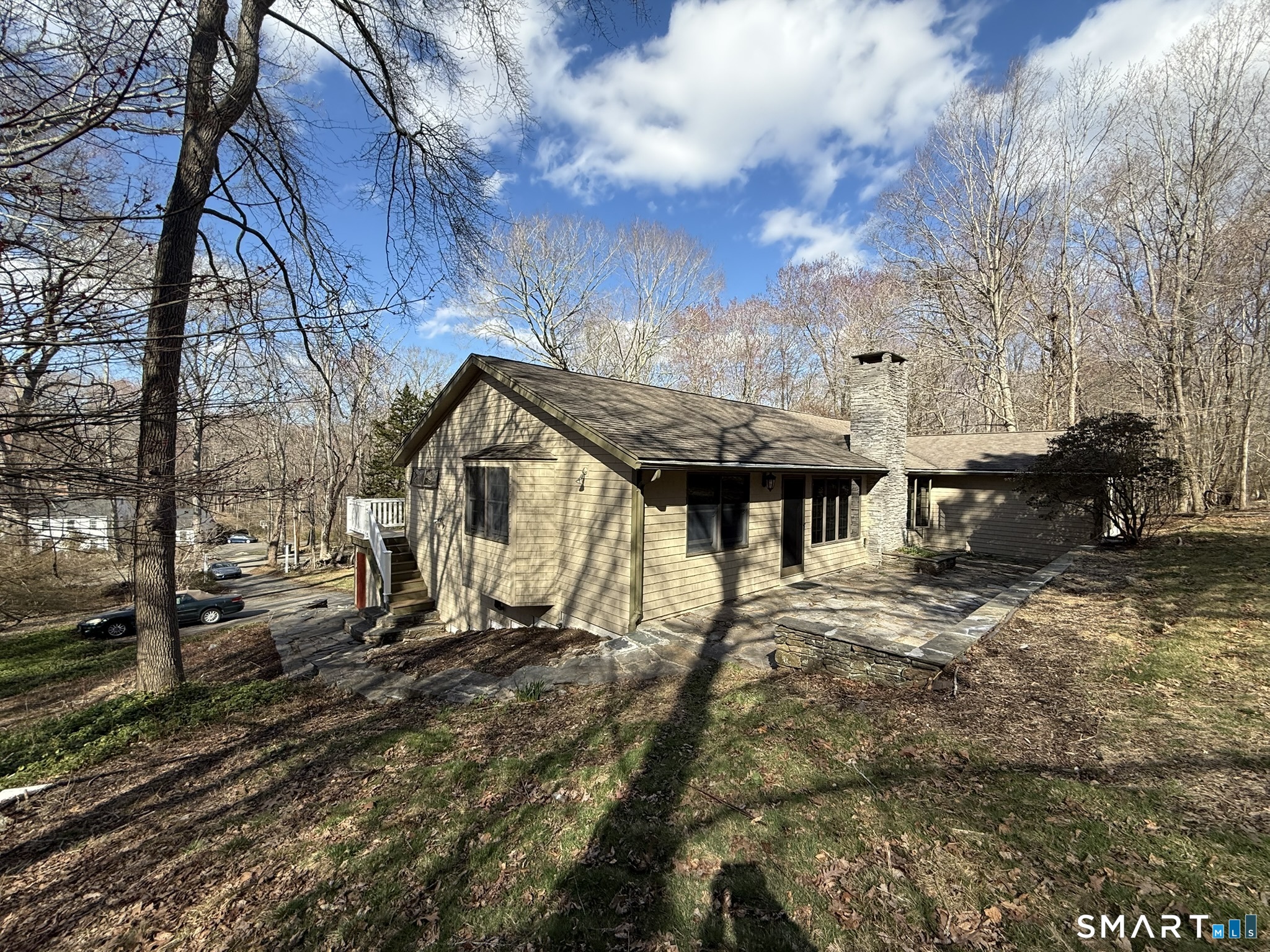 110 Town Woods Road Lyme, CT 06371 - Photo 5 of 37 a backyard of a house with table and chairs