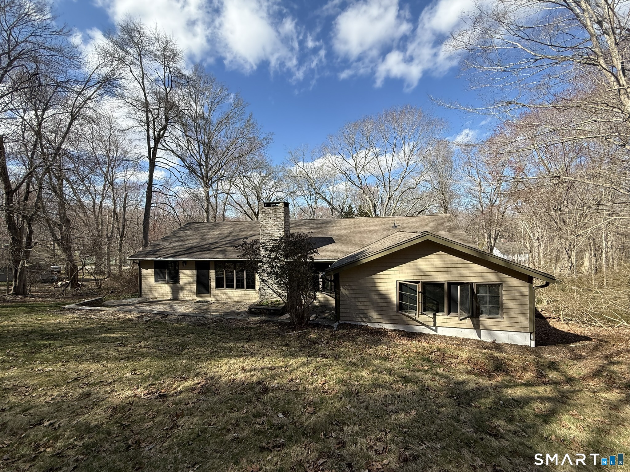 110 Town Woods Road Lyme, CT 06371 - Photo 6 of 37 a front view of a house with a yard
