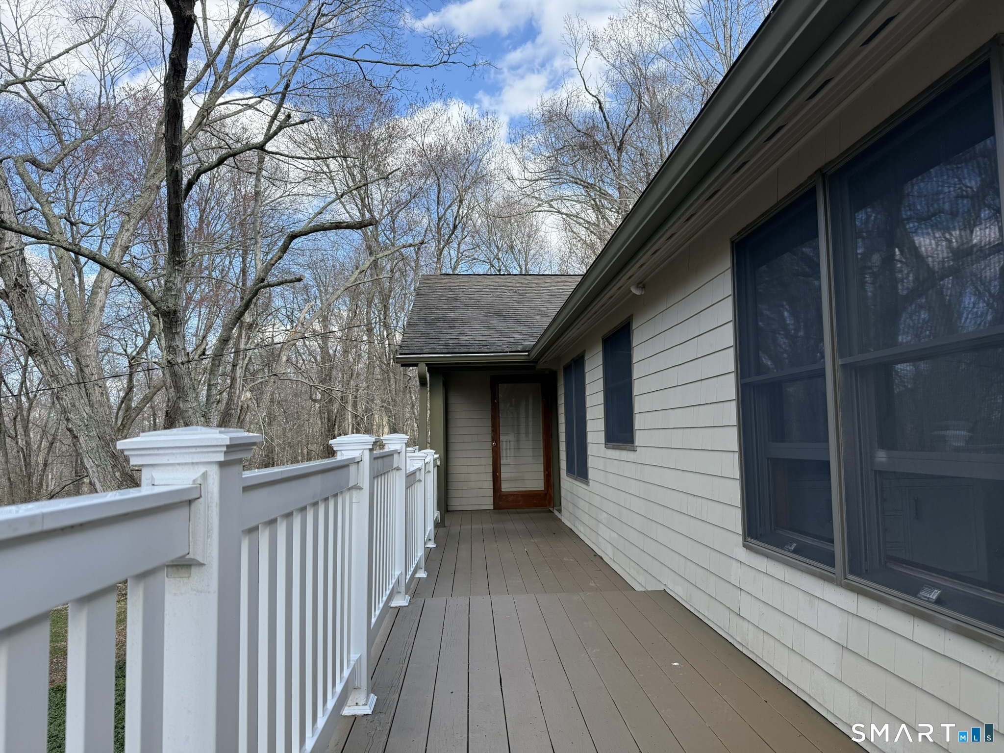 110 Town Woods Road Lyme, CT 06371 - Photo 9 of 37 a view of a house with wooden deck