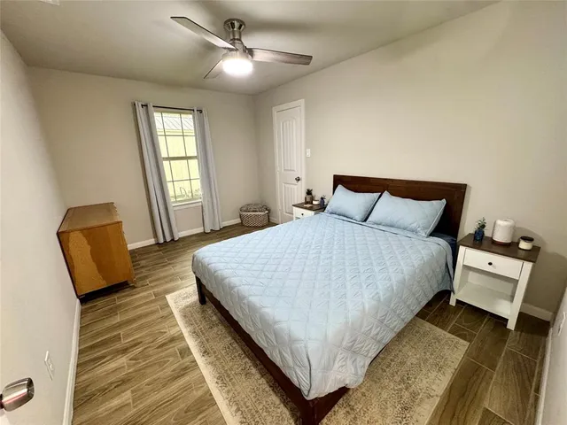a bedroom with a bed and window