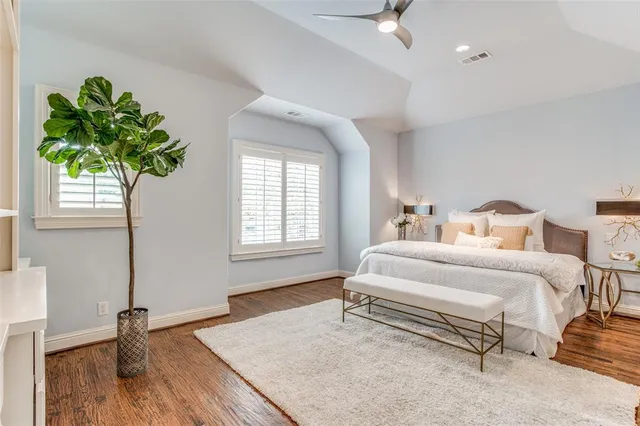a spacious bathroom with a tub sink and shower