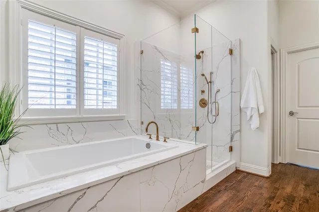 a spacious bathroom with double sink and a mirror