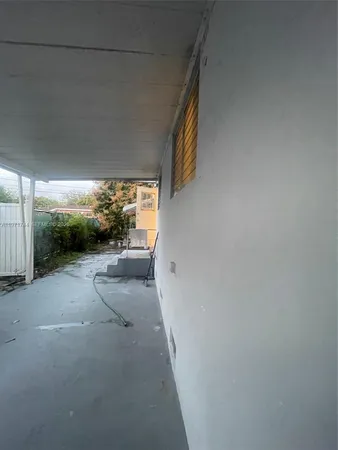 a view of a yard with a tree