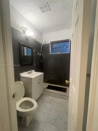 a view of empty room with windows