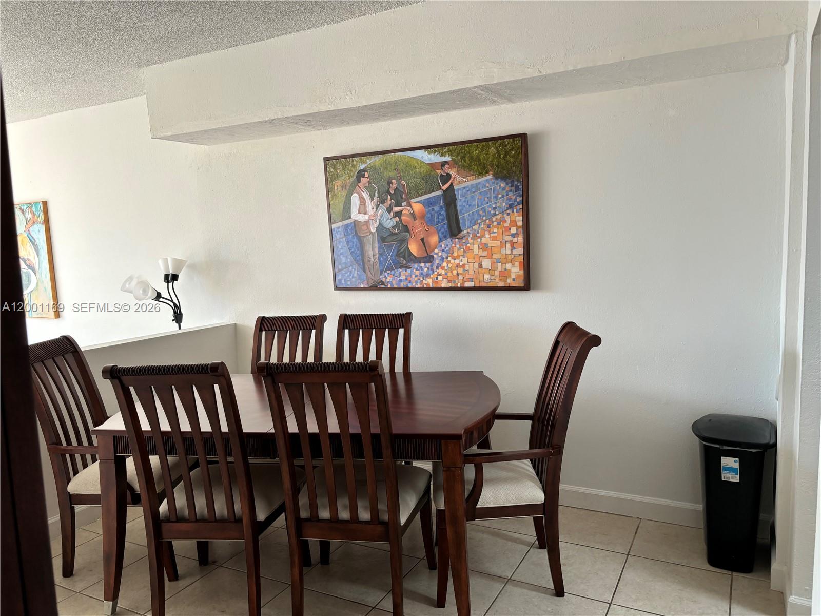 10900 Southwest 104th Street, Unit 303 Miami, FL 33176 - Photo 13 of 40 a view of a dining room with furniture and wooden floor