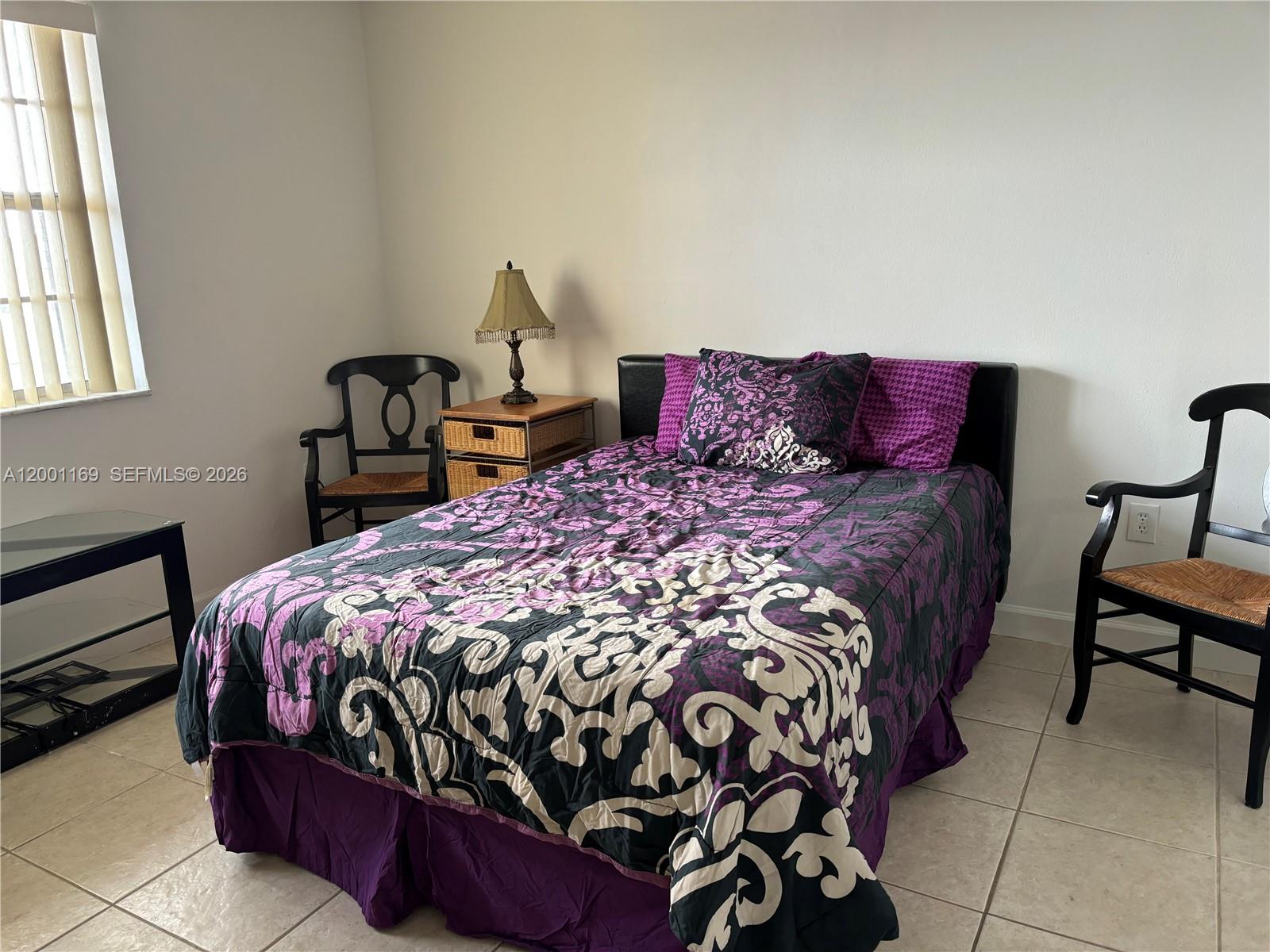 10900 Southwest 104th Street, Unit 303 Miami, FL 33176 - Photo 16 of 40 a bedroom with a bed and window