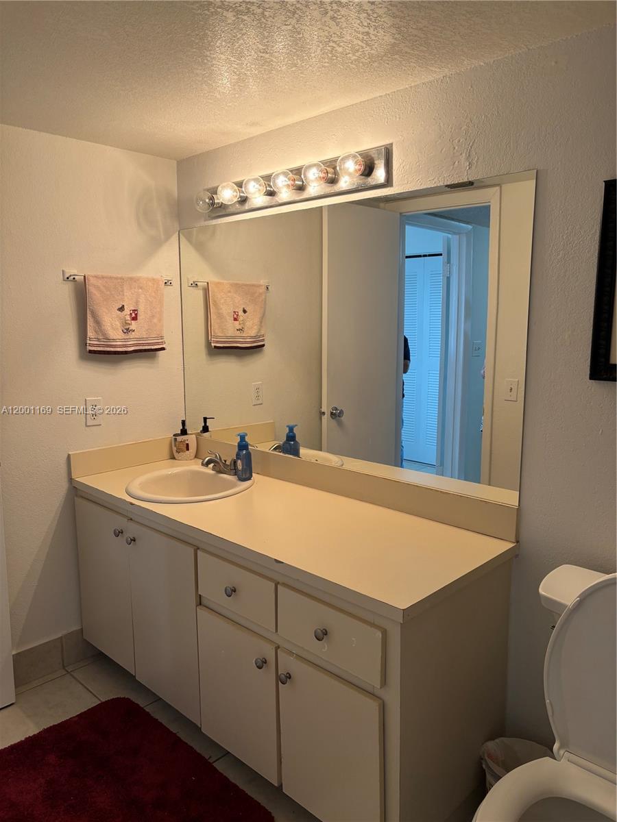 10900 Southwest 104th Street, Unit 303 Miami, FL 33176 - Photo 18 of 40 a bathroom with a sink and a mirror
