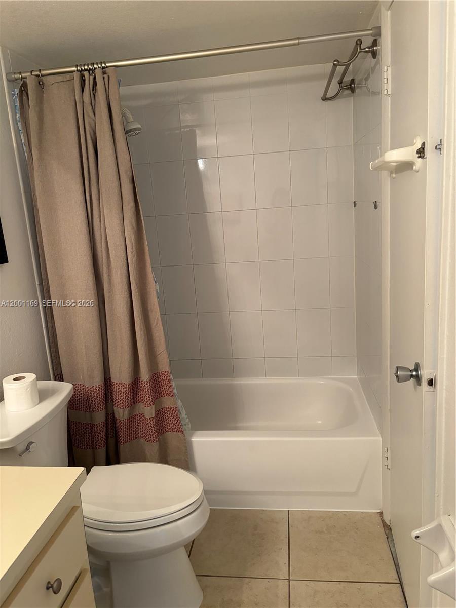 10900 Southwest 104th Street, Unit 303 Miami, FL 33176 - Photo 19 of 40 a bathroom with a shower and a toilet