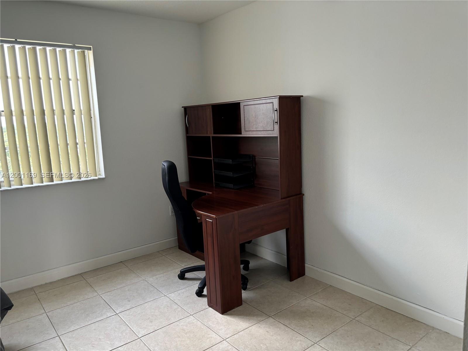 10900 Southwest 104th Street, Unit 303 Miami, FL 33176 - Photo 22 of 40 a room with a table and a window