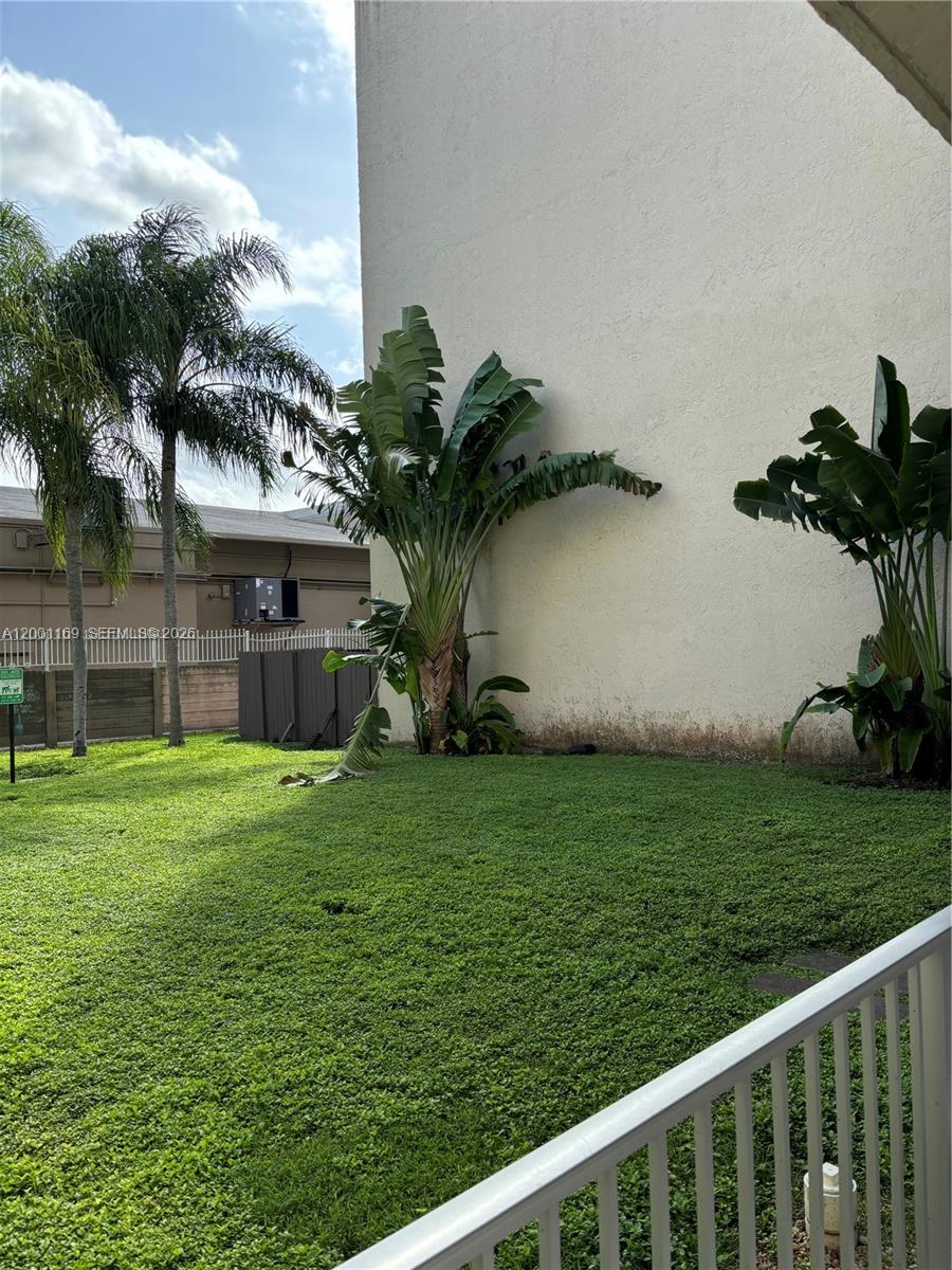 10900 Southwest 104th Street, Unit 303 Miami, FL 33176 - Photo 33 of 40 a backyard of a house with lots of green space