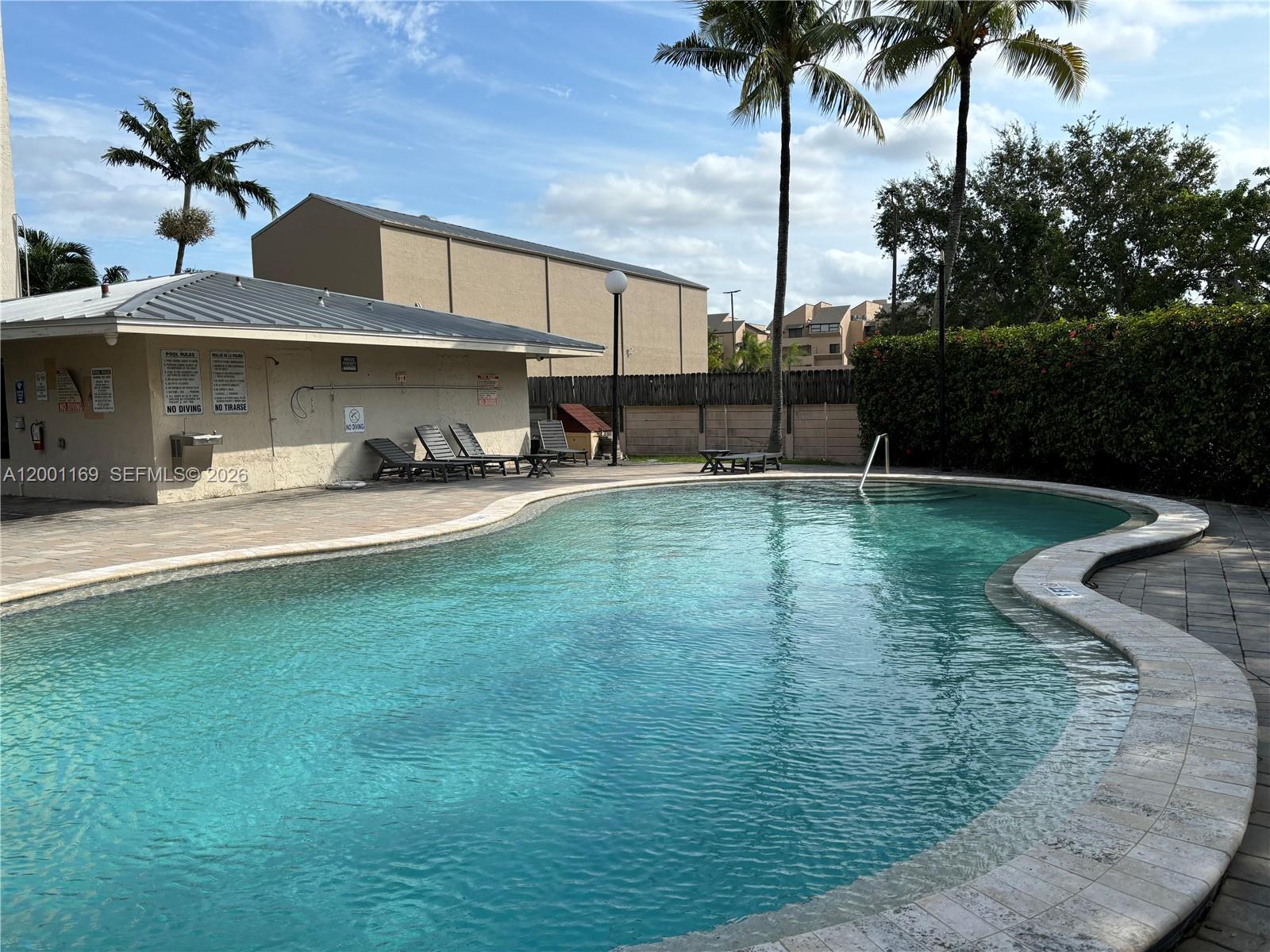 10900 Southwest 104th Street, Unit 303 Miami, FL 33176 - Photo 36 of 40 a house view with a sitting space and garden