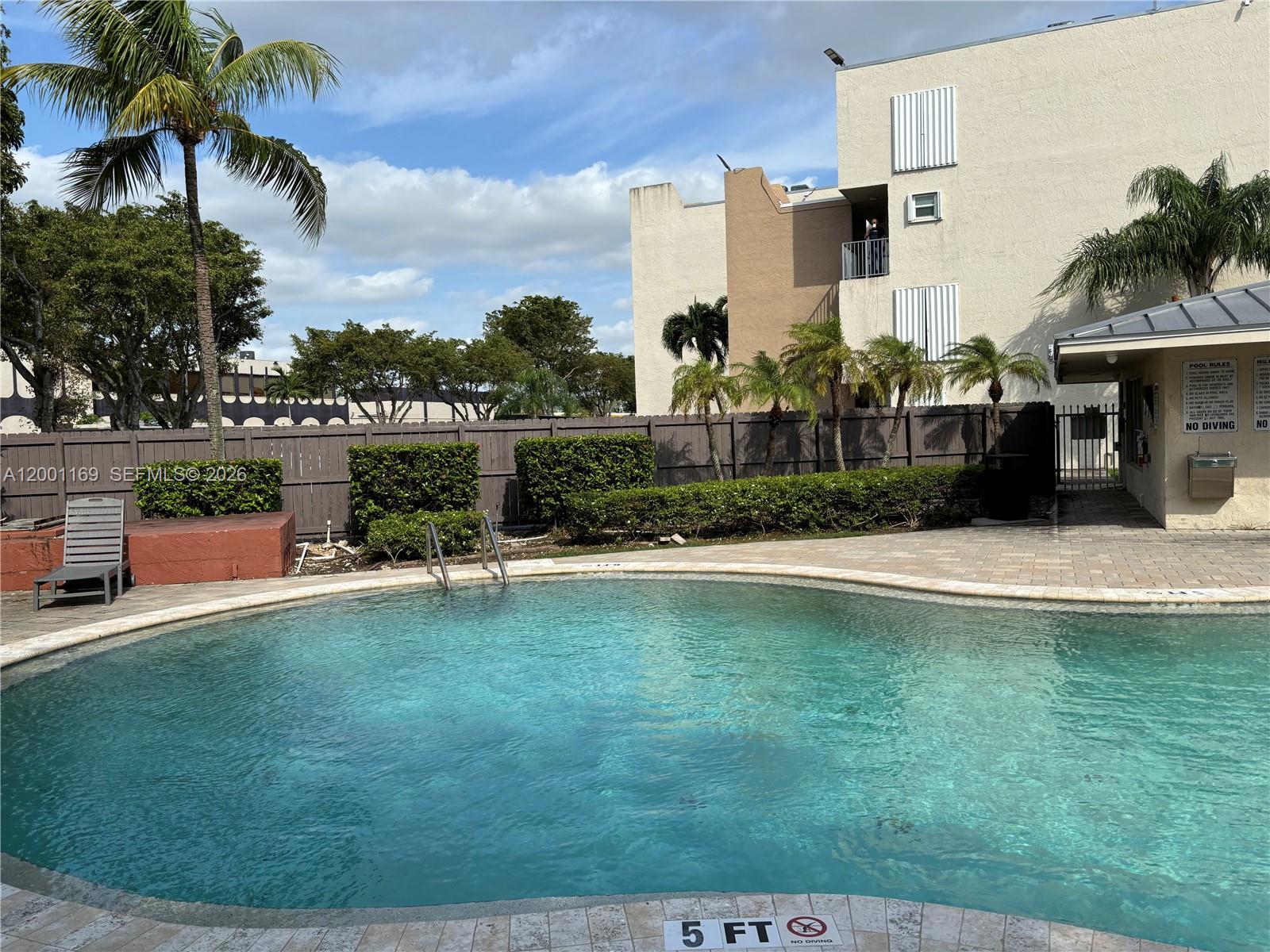 10900 Southwest 104th Street, Unit 303 Miami, FL 33176 - Photo 37 of 40 a view of a house with a swimming pool