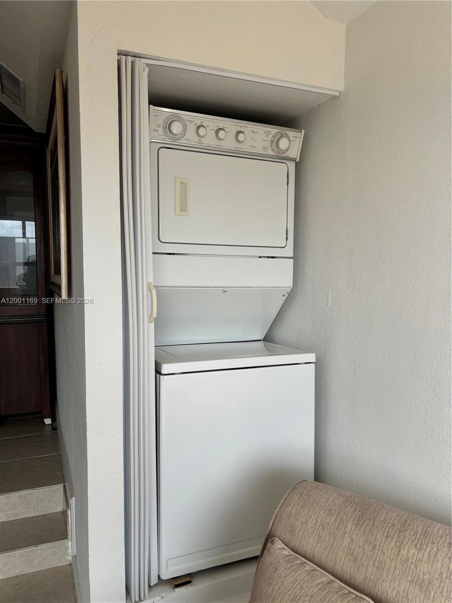 10900 Southwest 104th Street, Unit 303 Miami, FL 33176 - Photo 5 of 40 a utility room with dryer and washer