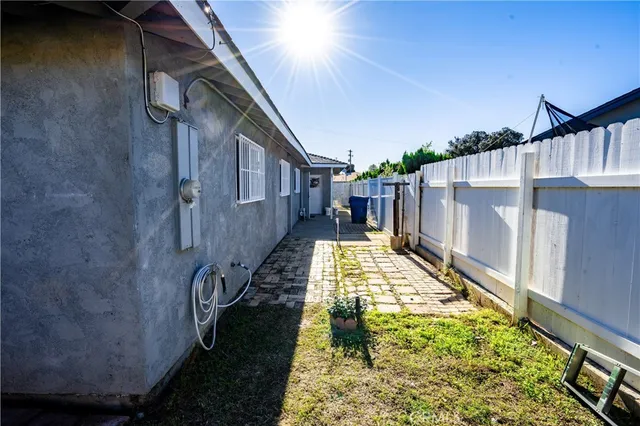 a view of balcony with wooden floor and fence