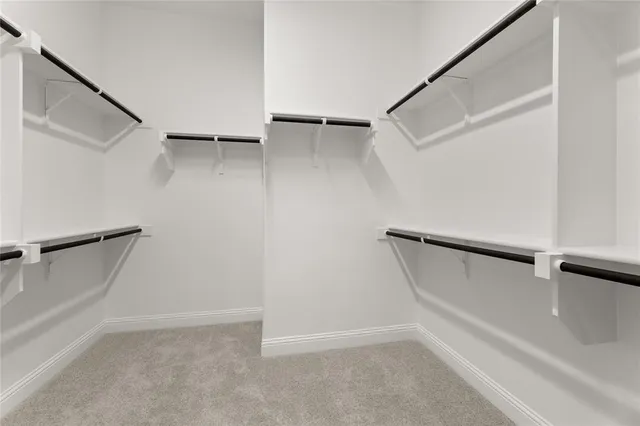 a view of an empty walk in closet