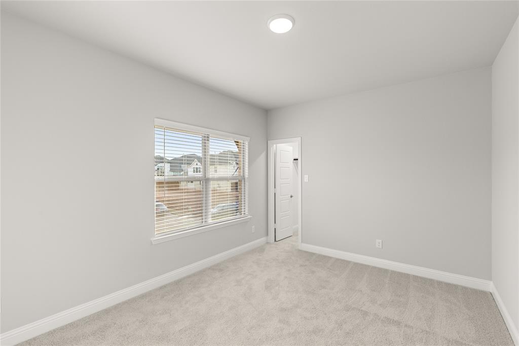 3539 Helios Lane Corinth, TX 76208 - Photo 25 of 33 an empty room with windows