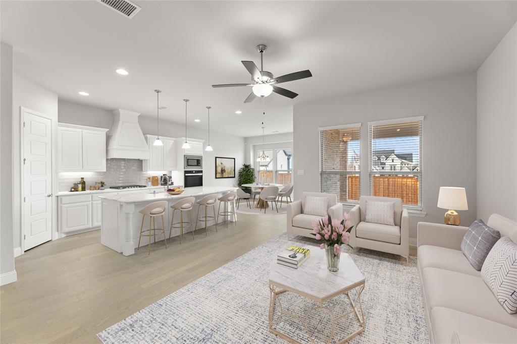 3539 Helios Lane Corinth, TX 76208 - Photo 3 of 33 a living room with furniture and kitchen view