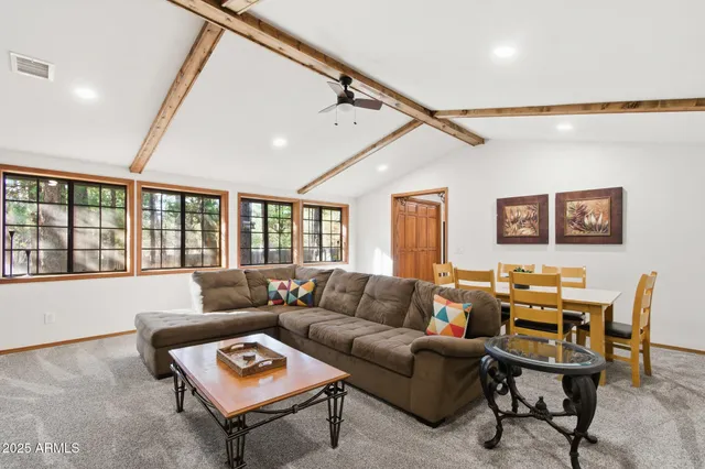 a spacious bedroom with a bed and a window