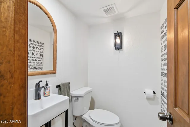 a bathroom with a double vanity sink toilet and shower