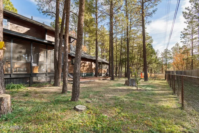 a outdoor space with furniture and floor to ceiling window