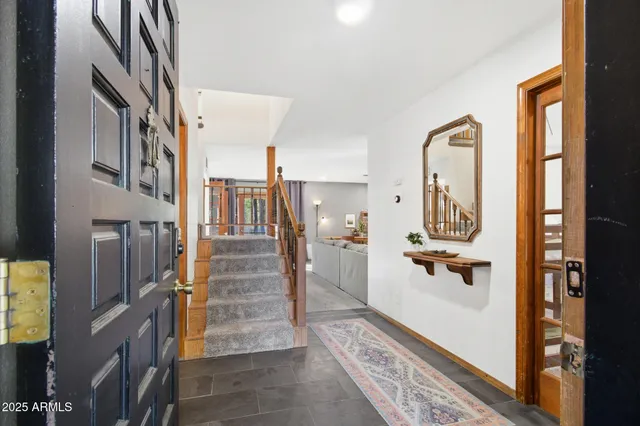 a view of a house with yard and sitting area